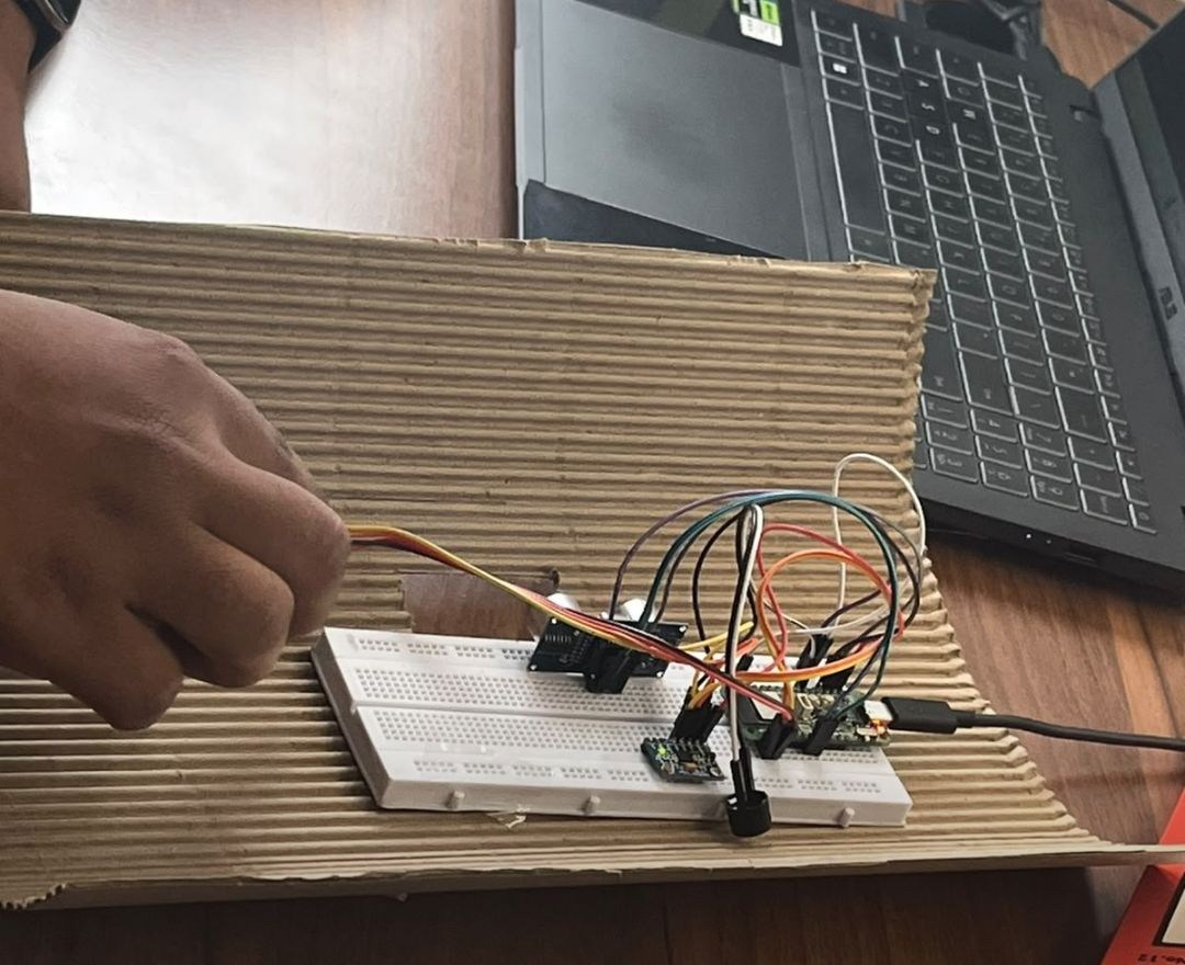 Wiring the breadboard inside the cardboard enclosure