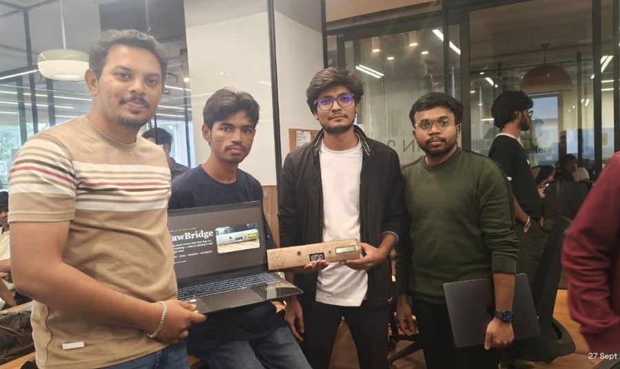 Team Techno Crackers holding the PawBridge device and dashboard