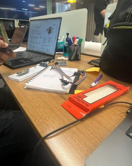 Laptop, notebook and jumper wires on the table on Saturday morning